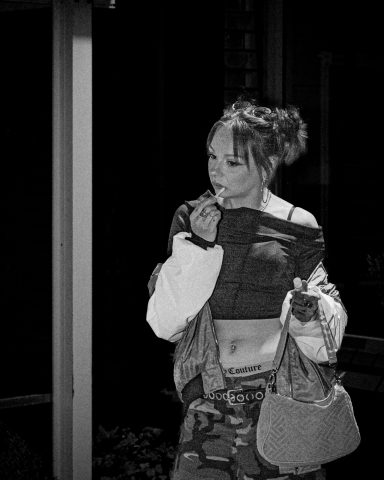 gritty y2k retro gritty retro image of a girl outside a night club