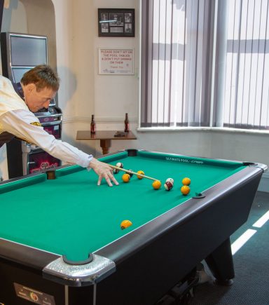 jimmy at the pool table in the carlton club jimmy the whirlwind white snooker player image from dave waddicor photography
