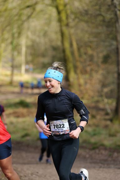 woman running in the forest of dean half marathon