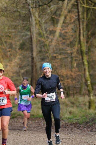 very happy woman in a cross country race